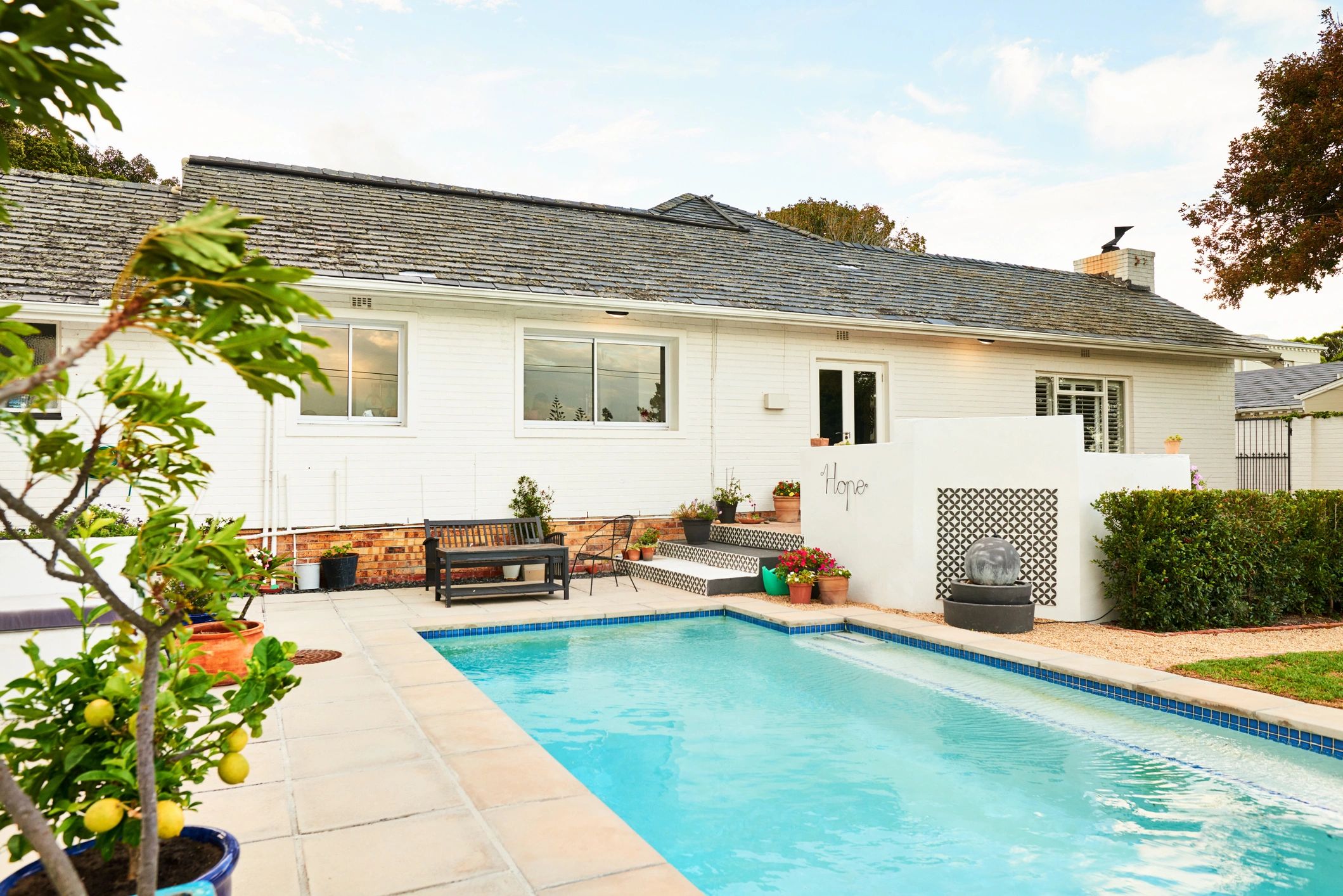 Backyard pool with fencing and patio