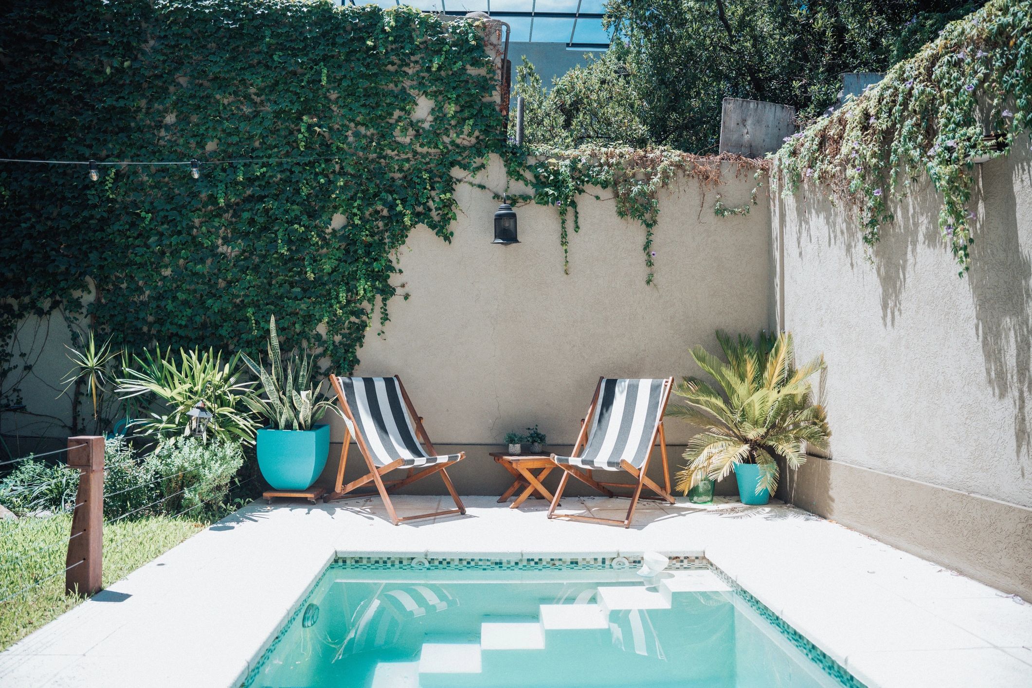 Backyard pool area with privacy fencing