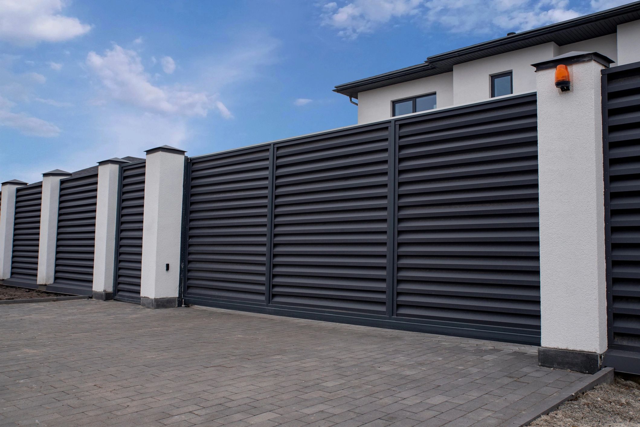 Automatic sliding driveway gate with opener